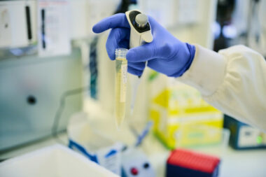 A scientist holds a test tube