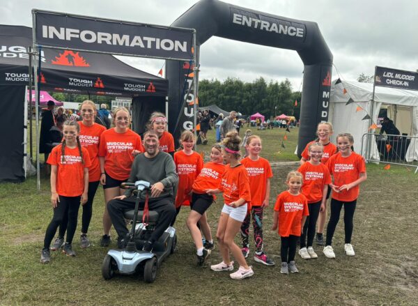 A family of fundraisers at a sporting event.