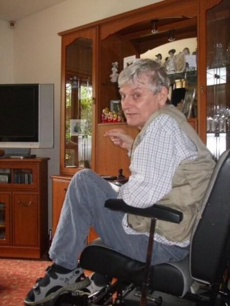 A women sitting in a chair in her living room