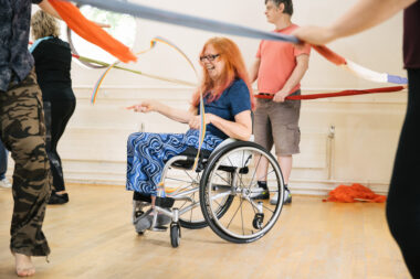 A happy women enjoys a vibrant class