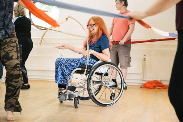 A happy women enjoys a vibrant class