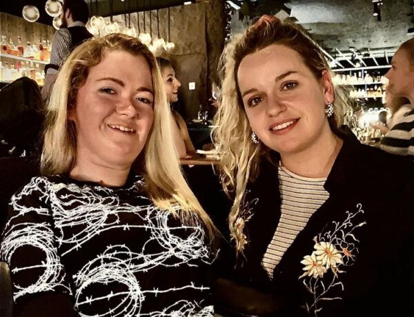 Two women with cocktails in a trendy bar