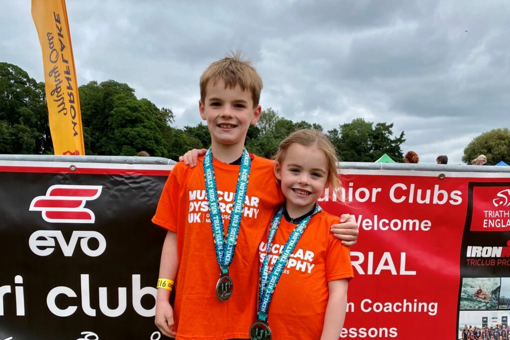 Young children, Oliver and Eleanor with medals
