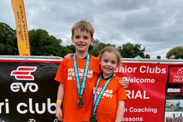 Young children, Oliver and Eleanor with medals