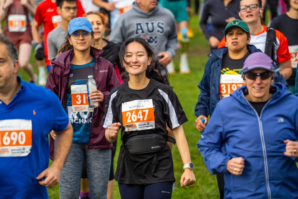A runner smiles while completing the Cambridge 10k.