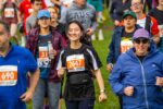 A runner smiles while completing the Cambridge 10k.