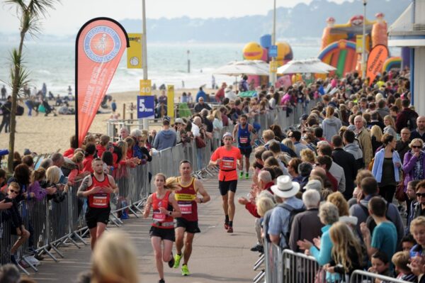 A crowd watches a race