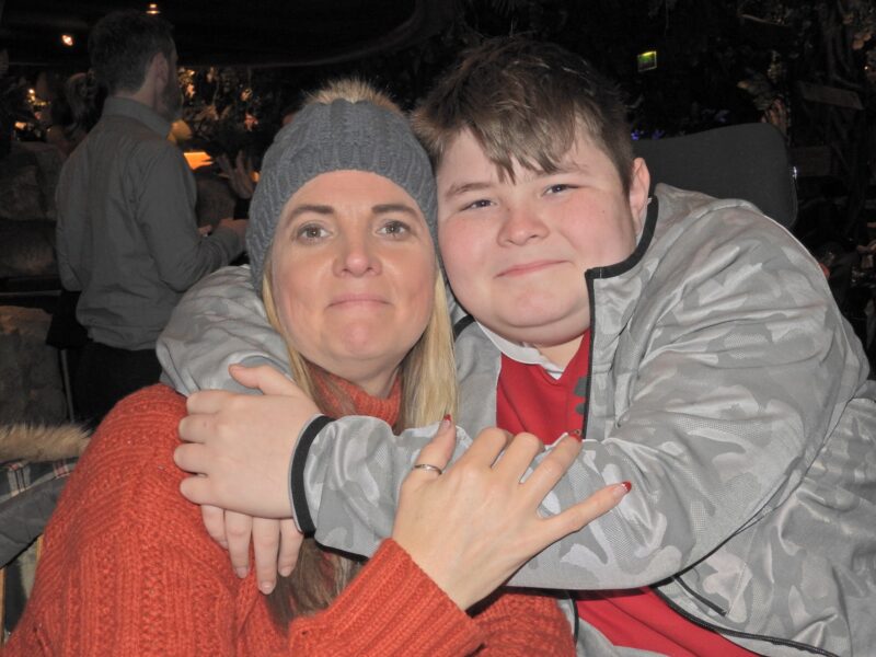 A mum and her son pose for a picture
