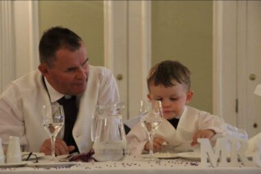A man and child sit at a table