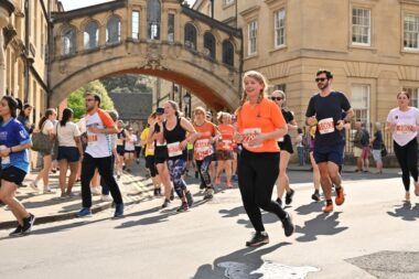 A group of runners move through Oxford