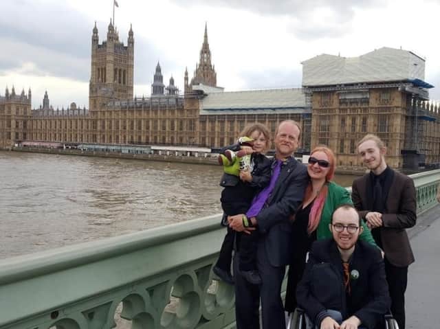 Emma-Jayne Ashley and her family are stood on a bridge