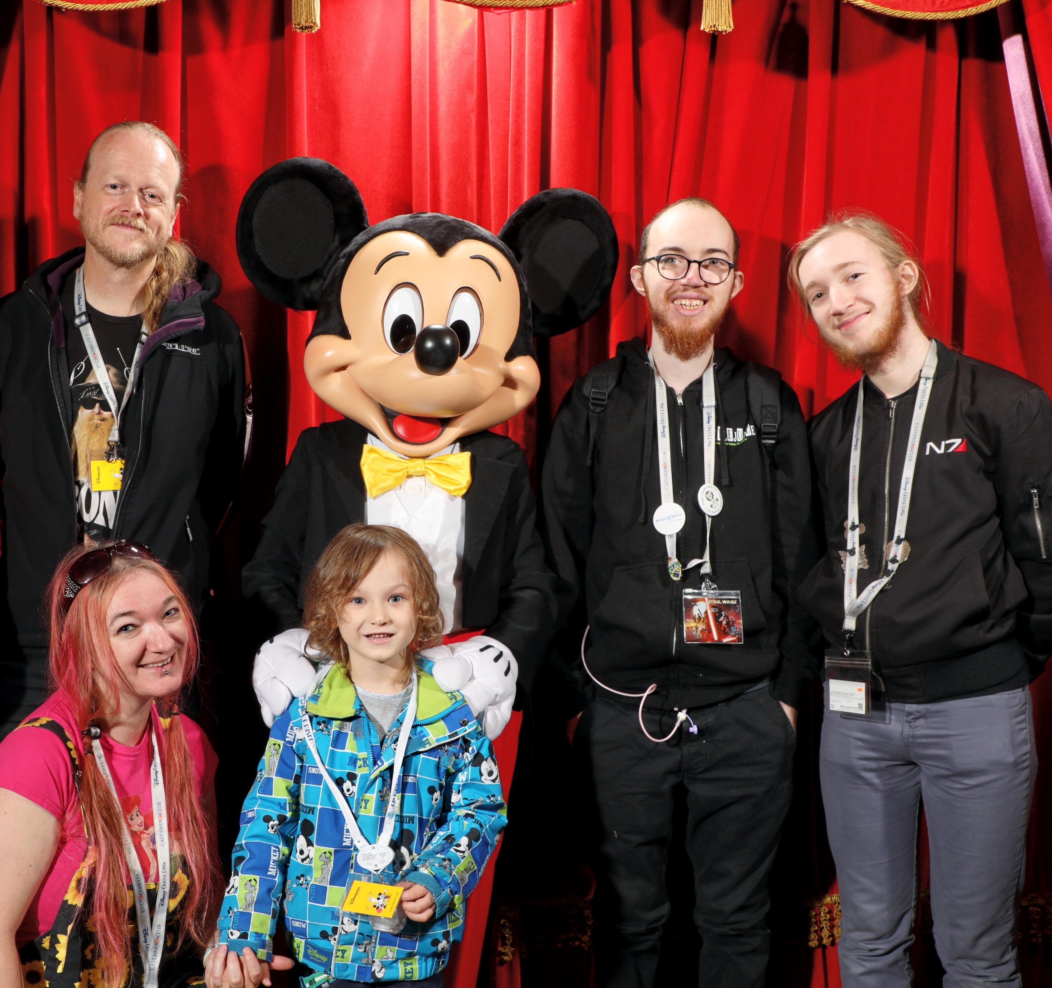 Emma-Jayne Ashley and her family are stood with Mickey Mouse