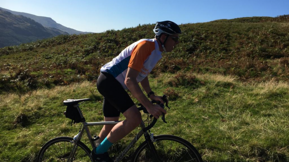 Scott Mitchell cycling up hill