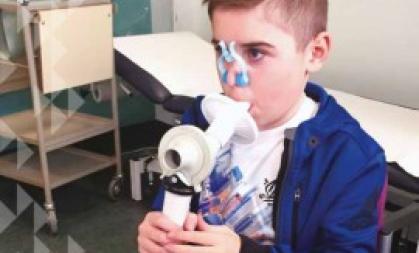 Front cover of the Campaign Spring 2016 newsletter. The main image shows a young boy using breathing equipment in a medical setting.