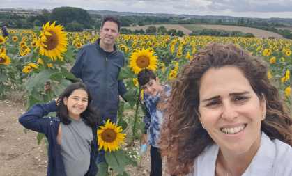 Yael Shilo with her family in sunflower field