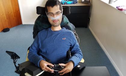 Image of Vivek holding a gaming controller
