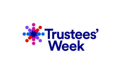 Trustees Week logo: Navy blue font reading 'Trustees' Week' with an purple, pink, orange and blue star-like shape.