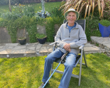 Andy sitting in his garden