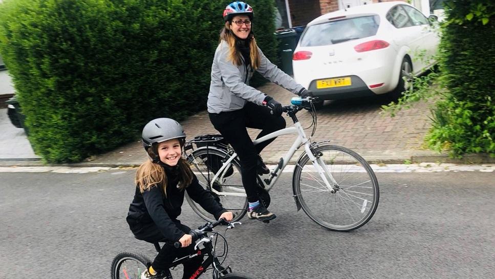 Rebecca and Edie Leary on their bicycles