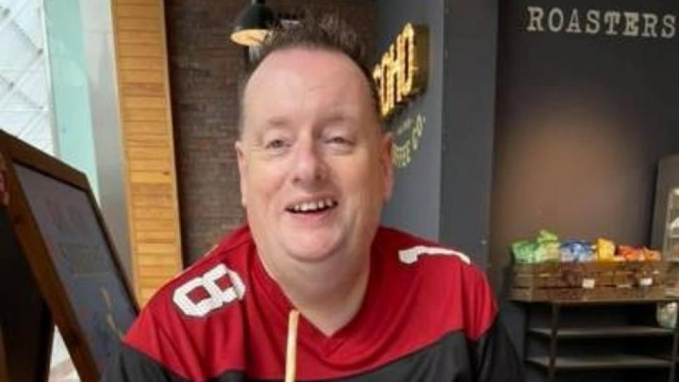 Man with mitochondrial disease drinking coffee in a cafe