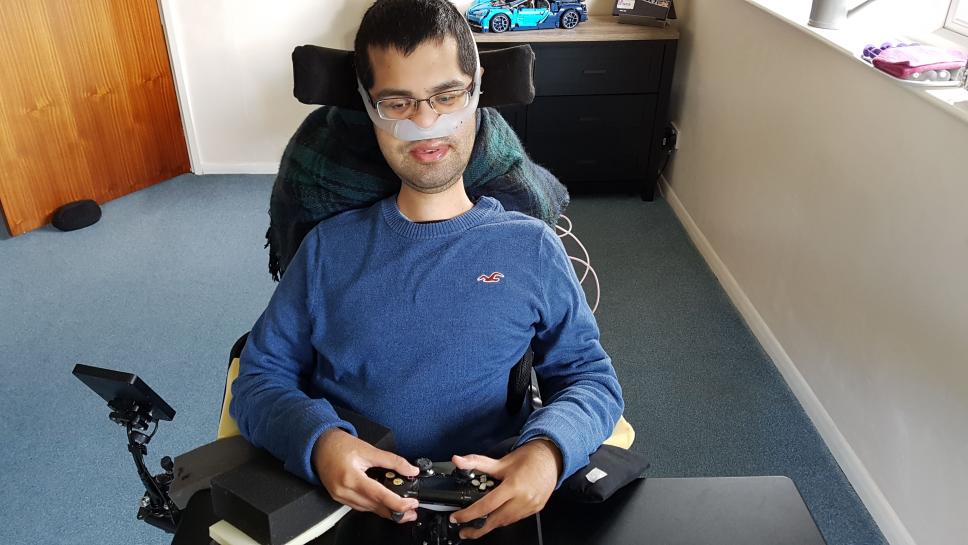 Image of Vivek holding a gaming controller